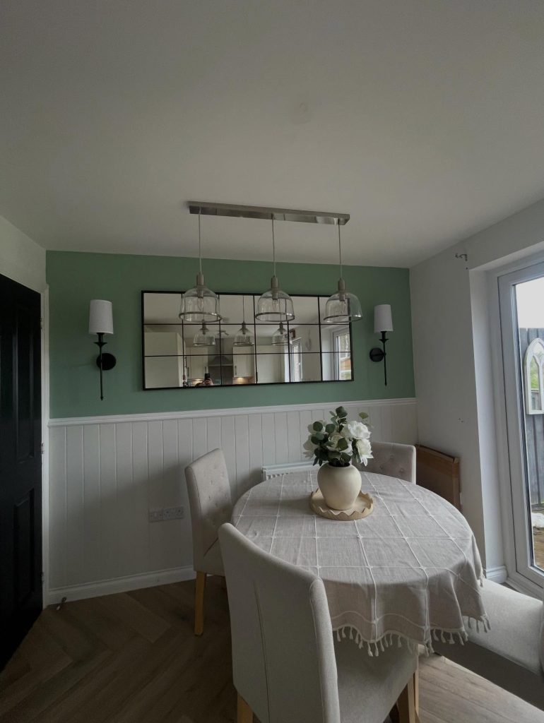 Pendant lighting and wall lights installed over a dining table by RSD Electrical, Glasgow